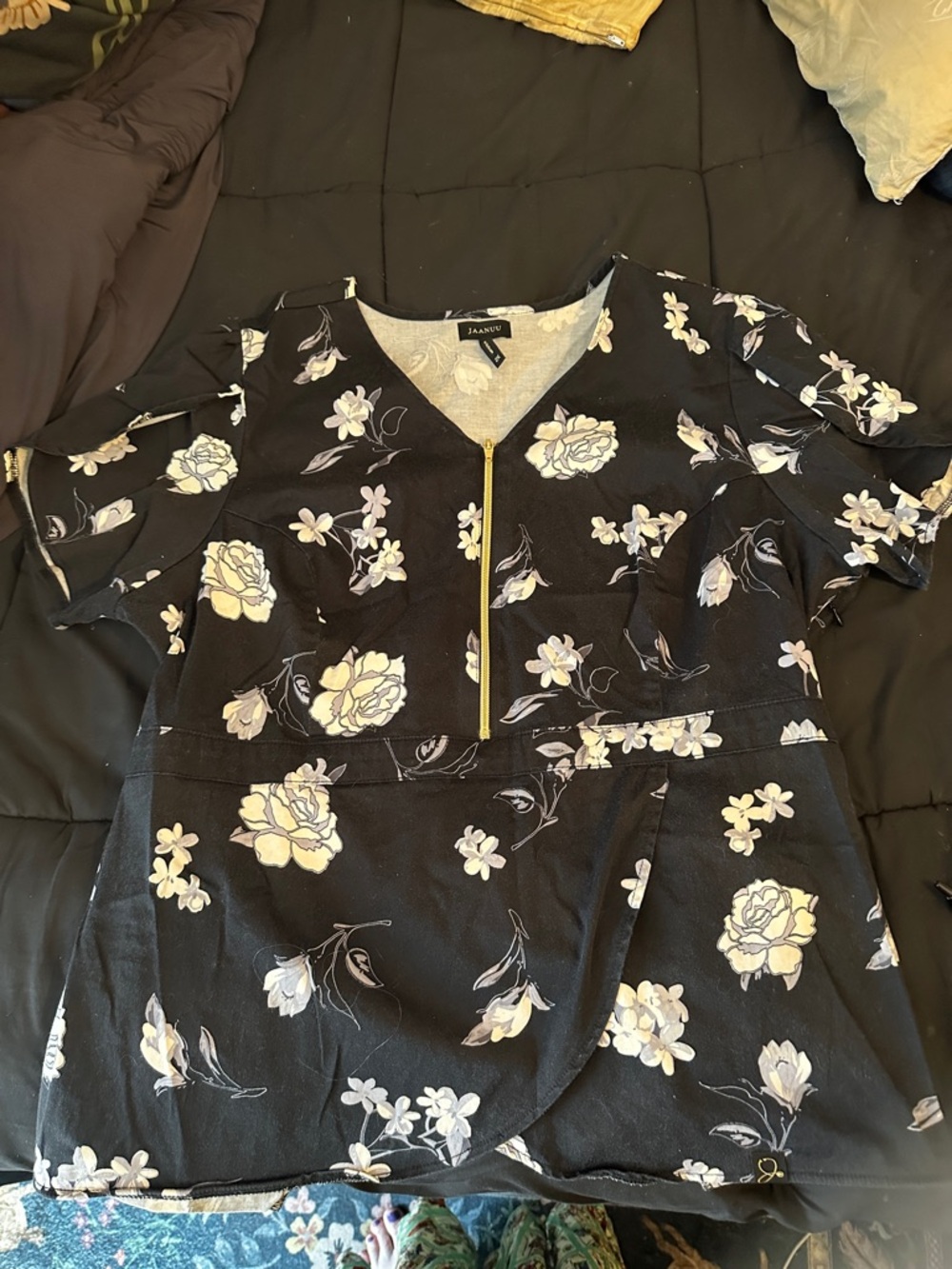 Jaanuu Black Floral Zip-Front Women's Top with tulip hemline and arms
